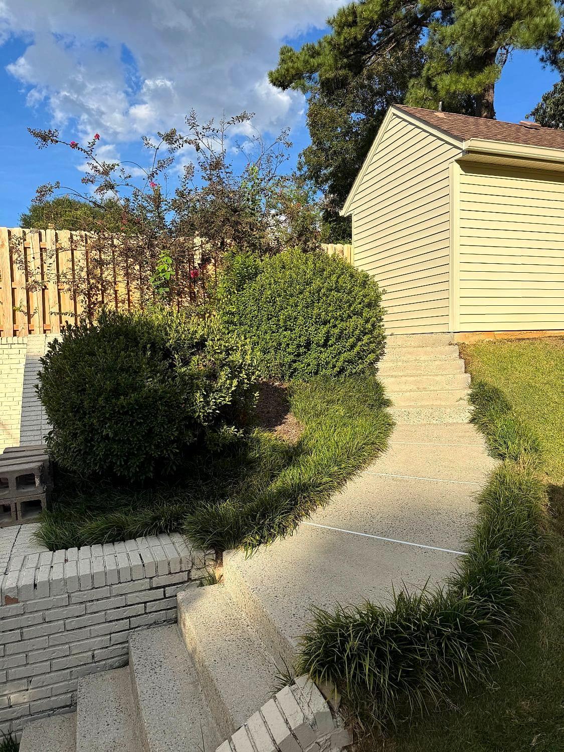 Clean, bright concrete steps and walkway after pressure washing